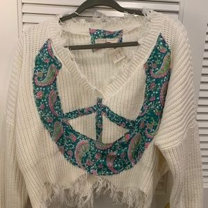 Ivory crop sweater with stitched color peace sign